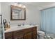 Well-lit bathroom with a vanity, toilet, and shower at 146 37Th Nw St, Hildebran, NC 28601