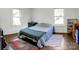 Bright bedroom featuring hardwood floors and multiple windows for natural light at 146 37Th Nw St, Hildebran, NC 28601