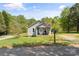Charming single-story home with a cozy front porch, American flag, and well-maintained lawn at 146 37Th Nw St, Hildebran, NC 28601