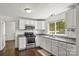 Bright kitchen with white cabinetry, stainless steel appliances, and ample counter space at 146 37Th Nw St, Hildebran, NC 28601