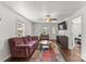 Inviting living room featuring hardwood floors, a ceiling fan, and ample natural light at 146 37Th Nw St, Hildebran, NC 28601