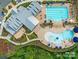 Aerial view of community pool and pool house with ample seating and lush landscaping at 1528 Half Pint Loop, Fort Mill, SC 29708