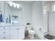 Bright bathroom with white cabinets, vanity, and glass enclosed shower at 1528 Half Pint Loop, Fort Mill, SC 29708