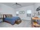 Cozy bedroom featuring two windows, a vintage trunk, and a comfortable bed at 1528 Half Pint Loop, Fort Mill, SC 29708