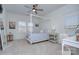 Bright bedroom features a four-poster bed, two windows, and neutral tones at 1528 Half Pint Loop, Fort Mill, SC 29708