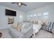 Bedroom sitting area with ceiling fan, sofa, chairs and wall mounted television at 1528 Half Pint Loop, Fort Mill, SC 29708