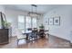 Formal dining area boasting a dark wood table and views through shuttered windows at 1528 Half Pint Loop, Fort Mill, SC 29708
