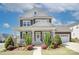 Charming two-story home with a covered front porch and well-manicured landscaping at 1528 Half Pint Loop, Fort Mill, SC 29708