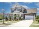 Charming two-story home with a well-manicured lawn, a basketball hoop, and a two-car garage at 1528 Half Pint Loop, Fort Mill, SC 29708