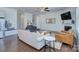 Spacious living room with fireplace, ceiling fan, and hardwood floors at 1528 Half Pint Loop, Fort Mill, SC 29708