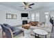 Comfortable living area with a fireplace, hardwood floors, and lots of natural light at 1528 Half Pint Loop, Fort Mill, SC 29708