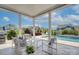 Covered patio with outdoor seating, pool, and scenic neighborhood views at 1528 Half Pint Loop, Fort Mill, SC 29708