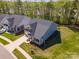 Stunning aerial view of the home with manicured lawns, landscaping, and neighborhood setting at 19006 Brandon James Dr, Cornelius, NC 28031