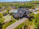 Scenic aerial view of the clubhouse with pool, bocce ball court and meticulously landscaped grounds at 19006 Brandon James Dr, Cornelius, NC 28031