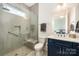 Modern bathroom with a glass-enclosed shower, and sleek vanity at 19006 Brandon James Dr, Cornelius, NC 28031
