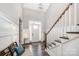 Elegant foyer with high ceilings, hardwood floors, staircase, and a welcoming ambiance at 19006 Brandon James Dr, Cornelius, NC 28031