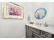 Stylish powder room with a modern vanity, decorative mirror, and elegant fixtures at 19006 Brandon James Dr, Cornelius, NC 28031