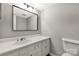 Traditional bathroom with white vanity, neutral walls, framed mirror, and classic fixtures at 194 Riverview Ter, Clover, SC 29710