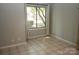 Bedroom featuring tiled floors, a large window, and neutral walls at 194 Riverview Ter, Clover, SC 29710