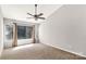 Well-lit bedroom with carpet flooring, a fan and a window with curtains and blinds at 194 Riverview Ter, Clover, SC 29710