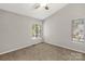 Bedroom featuring neutral walls and carpet with two large windows at 194 Riverview Ter, Clover, SC 29710