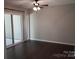 Bedroom featuring hardwood floors, neutral walls, ceiling fan, and sliding door access to patio at 194 Riverview Ter, Clover, SC 29710