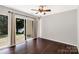 Bedroom featuring hardwood floors, fan and sliding door with backyard access at 194 Riverview Ter, Clover, SC 29710