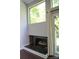 Living room with a sleek fireplace, large windows, and a sliding glass door at 194 Riverview Ter, Clover, SC 29710