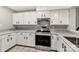 Bright kitchen with white cabinets, stainless steel appliances, and granite counters at 194 Riverview Ter, Clover, SC 29710
