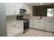 Bright kitchen featuring white cabinets, stainless steel appliances, and granite countertops at 194 Riverview Ter, Clover, SC 29710