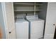 Laundry closet with washer and dryer, and louvered closet doors at 194 Riverview Ter, Clover, SC 29710