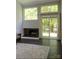 Bright living room featuring a fireplace, large windows, and sliding glass doors at 194 Riverview Ter, Clover, SC 29710