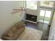 Open living room with a fireplace, plush sofa, ceiling fan and sliding glass door at 194 Riverview Ter, Clover, SC 29710
