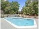 Community pool with ample seating, featuring a large swimming area surrounded by mature trees at 194 Riverview Ter, Clover, SC 29710