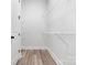 Walk in closet with white wire shelving and door with dark hardware at 2045 Cordia Cir, Newton, NC 28658
