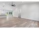 Spacious living room with high ceilings flows into an all-white kitchen with stainless steel appliances at 2045 Cordia Cir, Newton, NC 28658