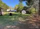 Expansive backyard with lush greenery, outbuilding, and gazebo at 22 Heritage View Rd, Hickory, NC 28601