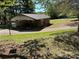 Lawn view of a home featuring a basketball court and a covered parking area at 22 Heritage View Rd, Hickory, NC 28601