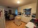 Functional kitchen and dining area with white cabinetry, wood floors, and ample counter space at 22 Heritage View Rd, Hickory, NC 28601