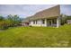 Green backyard featuring neutral siding and a covered patio at 269 Tradition Way, Rock Hill, SC 29732
