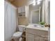 Bathroom featuring a white sink, cabinet, toilet, and shower with curtain at 269 Tradition Way, Rock Hill, SC 29732