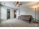 Neutral bedroom featuring a ceiling fan, neutral carpet and paint, and closet at 269 Tradition Way, Rock Hill, SC 29732