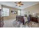 Neutral bedroom features a ceiling fan, large windows, and a patterned area rug at 269 Tradition Way, Rock Hill, SC 29732