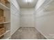 Walk-in closet with carpeted flooring and metal storage racks at 269 Tradition Way, Rock Hill, SC 29732