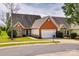 Charming, single-story home with brick accents, a two-car garage, and a well-manicured lawn at 269 Tradition Way, Rock Hill, SC 29732