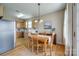 Cozy kitchen with wood cabinets, stainless steel appliances, and eat-in dining area at 269 Tradition Way, Rock Hill, SC 29732