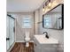 Stylish bathroom with modern fixtures, sleek vanity, and a glass-enclosed shower for a luxurious experience at 2924 Parkway Ave, Charlotte, NC 28208