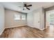 Comfortable bedroom boasts wood-look flooring and a ceiling fan for year-round comfort and energy efficiency at 2924 Parkway Ave, Charlotte, NC 28208