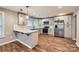 Modern kitchen featuring stainless steel appliances, white cabinets, and sleek countertops with peninsula bar at 2924 Parkway Ave, Charlotte, NC 28208