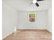 Bright, minimalist bedroom with light wood floors and a large window at 300 Cherry St, Belmont, NC 28012